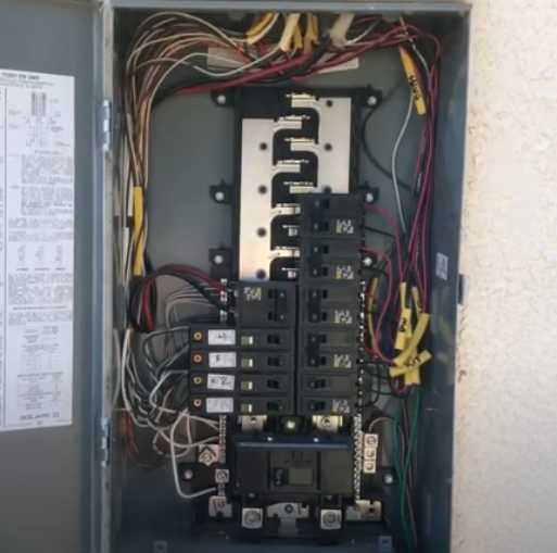 Picture of residential electrical panel with replaced electrical breakers